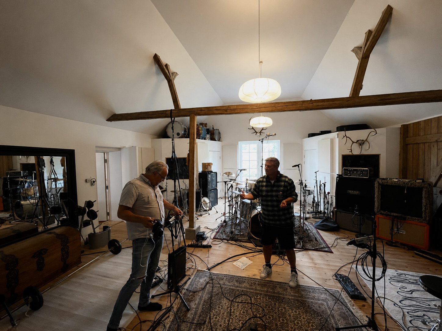 Drummer and guitarist tracking live in the main room